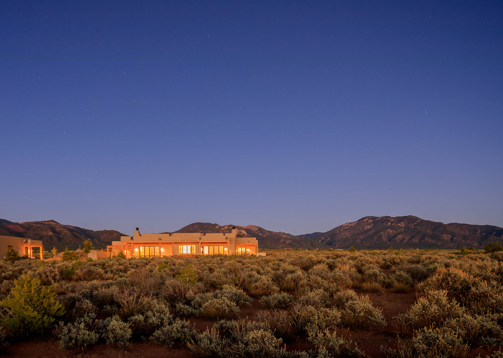 custom adobe home in the sage of Taos nm